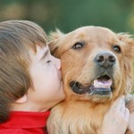 Boy Kissing Dog